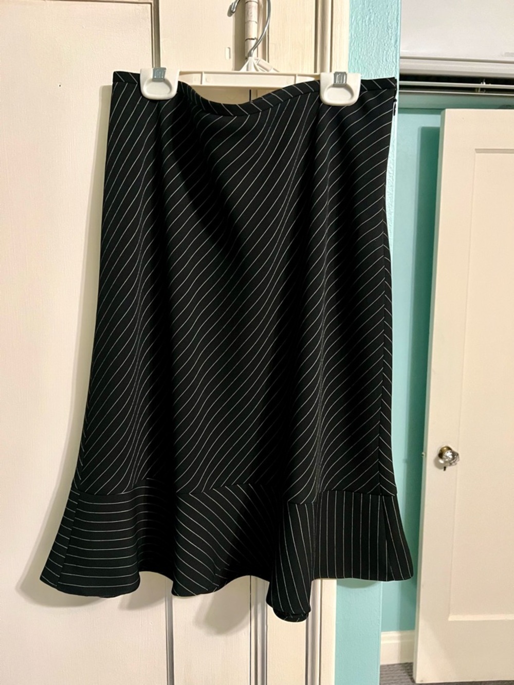 Ann Taylor Black Skirt with White Pinstripes, size 8, flares at the hem.